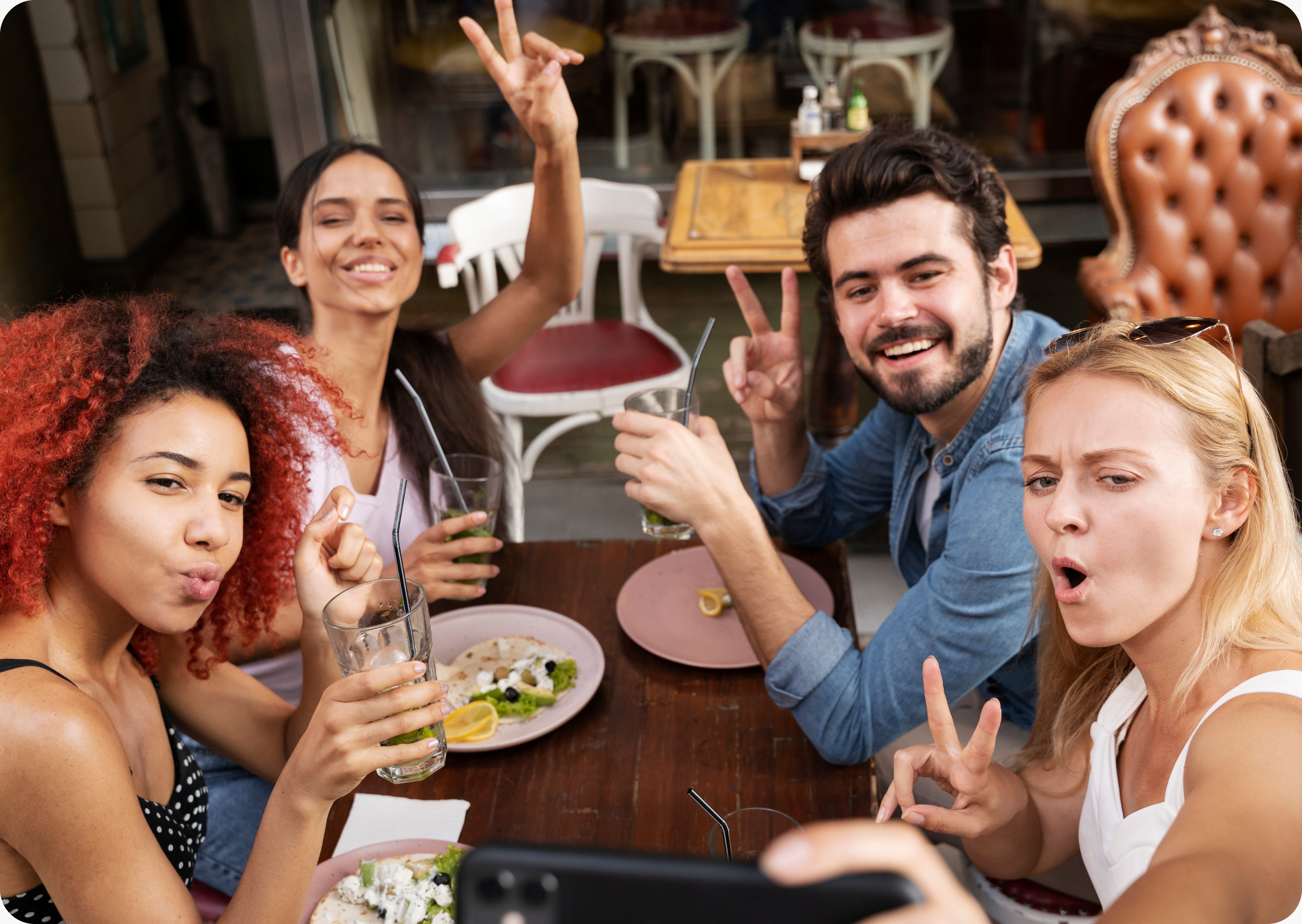 Friends enjoying food and conversation around a table