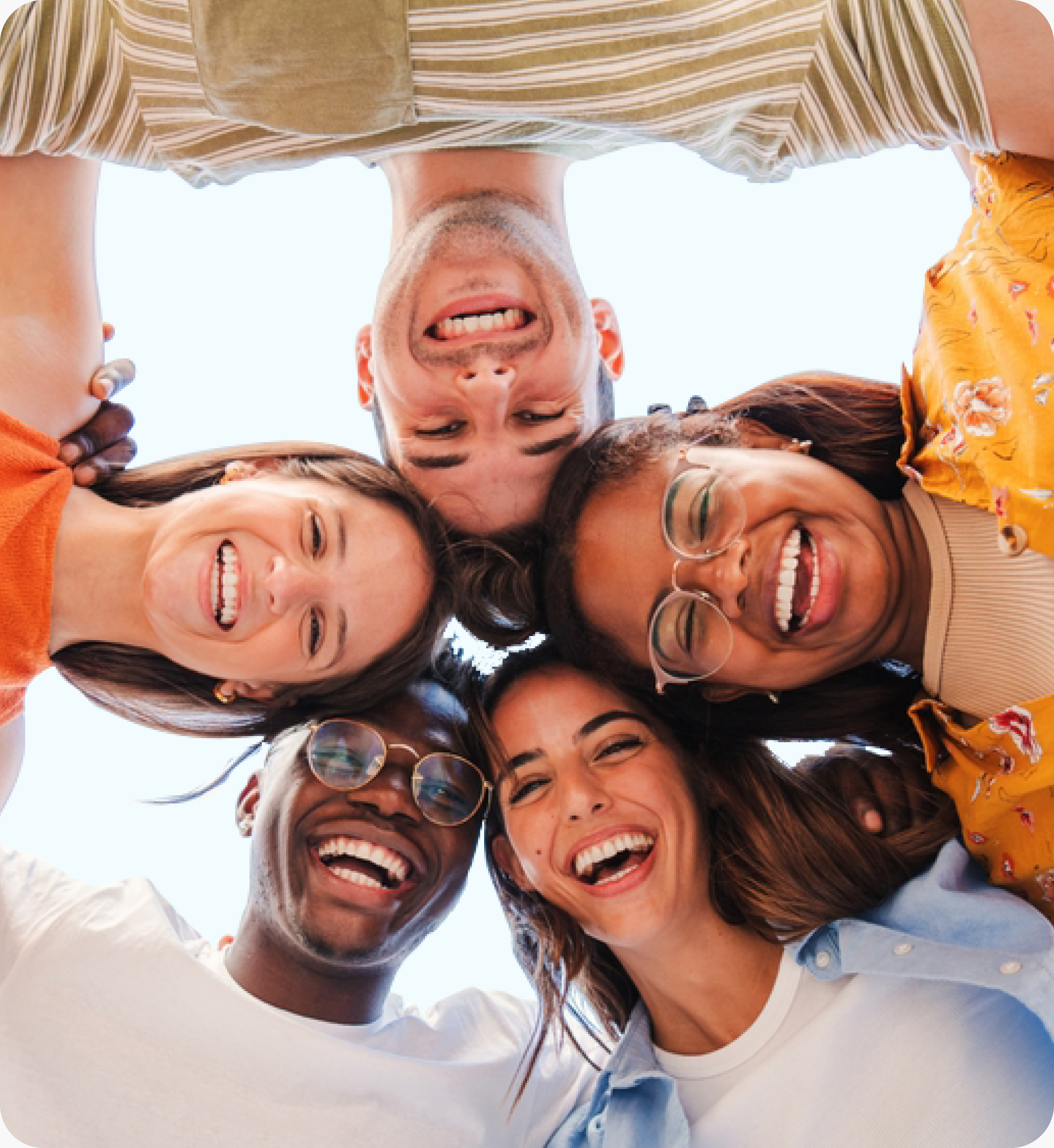 Friends smiling together in a circle